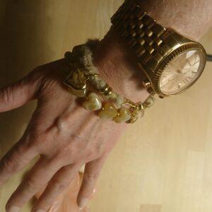 Hartjes armband van touw en stainless steel goud